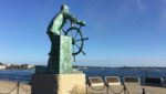 Man at the Wheel overlooks Gloucester Harbor